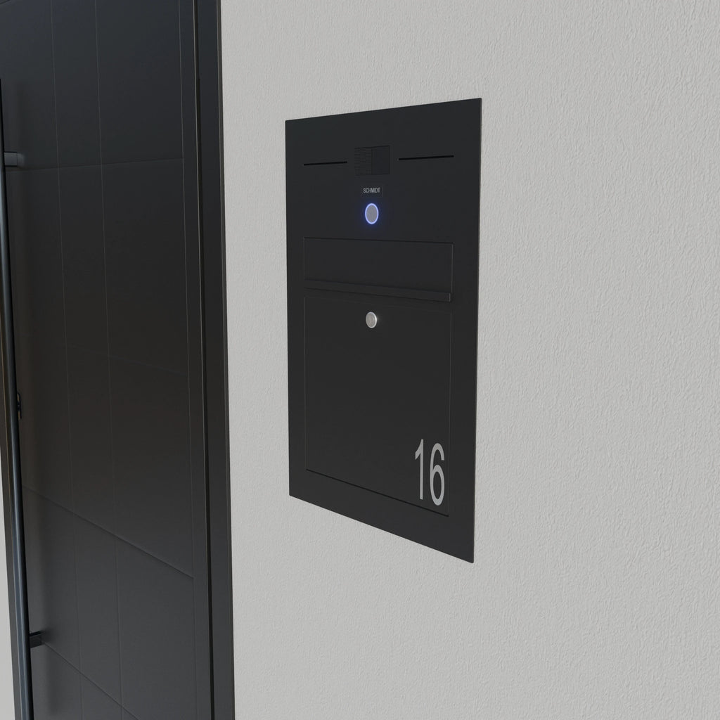 Schwarzer Briefkasten Edelstahl B3A-LC mit Klingel und Hausnummer 16 in einer Wand eingelassen